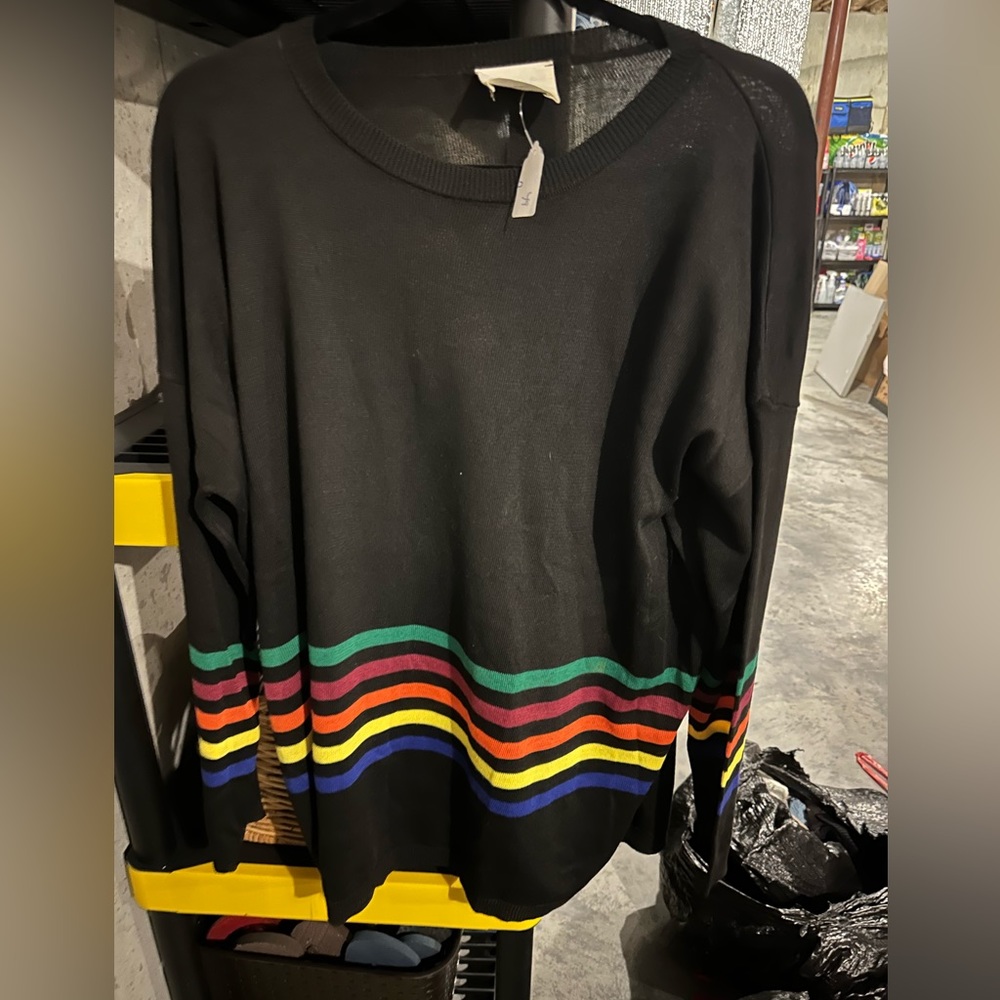 Great Black Sweater with Rainbow Stripes on the Bottom and sleeves. Size Medium